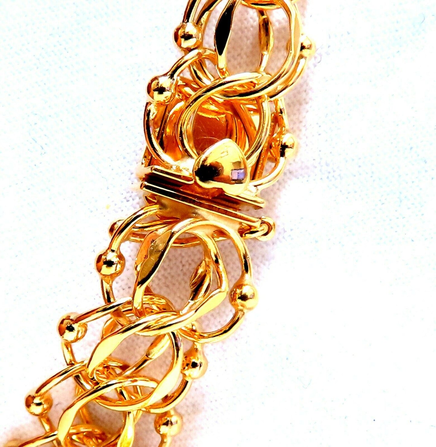 Nine Charms Link Bracelet 14kt gold 7 inch 54gm