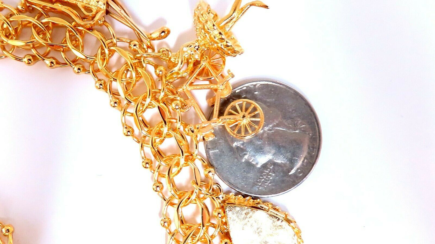 Nine Charms Link Bracelet 14kt gold 7 inch 54gm