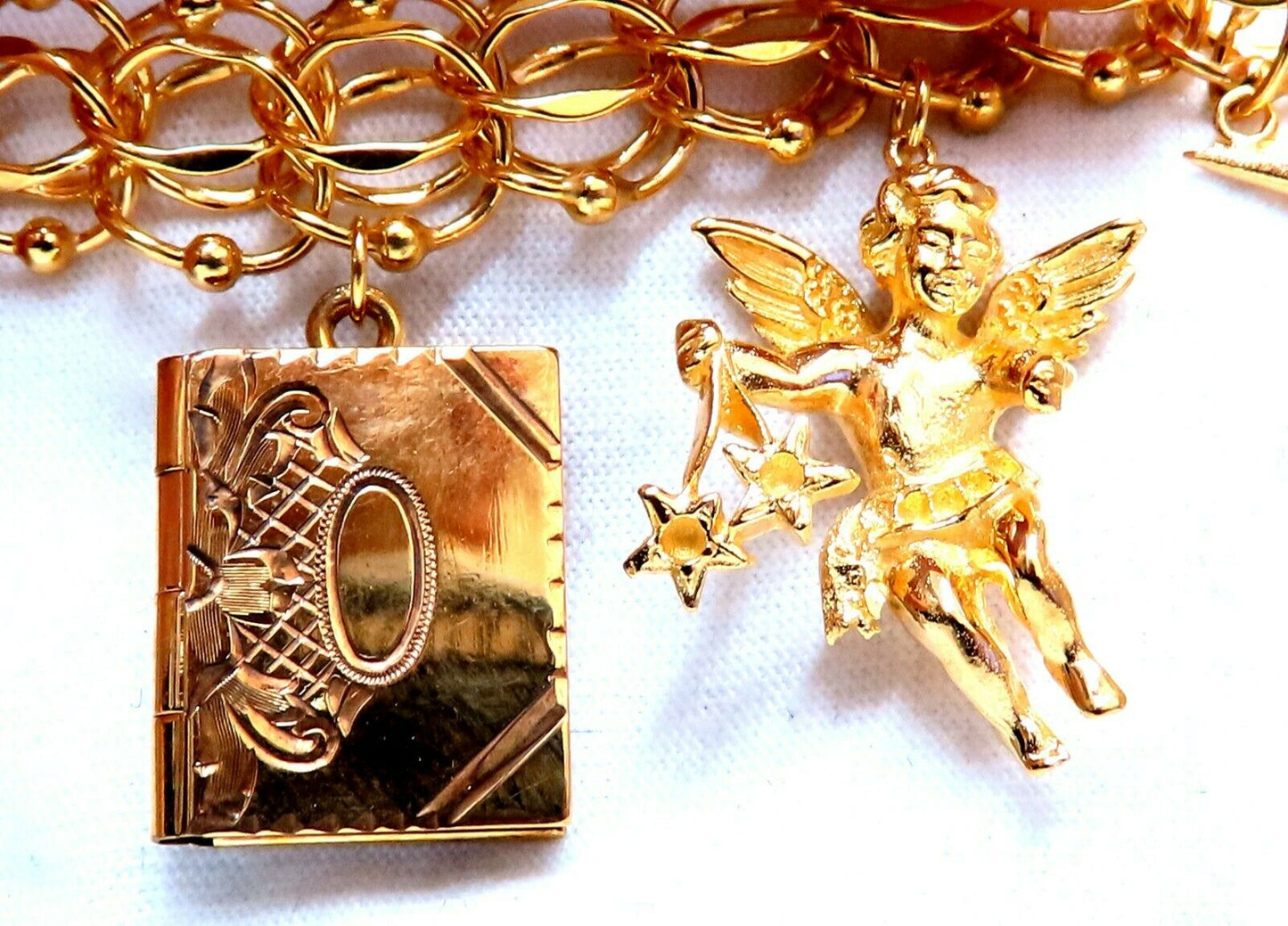 Nine Charms Link Bracelet 14kt gold 7 inch 54gm