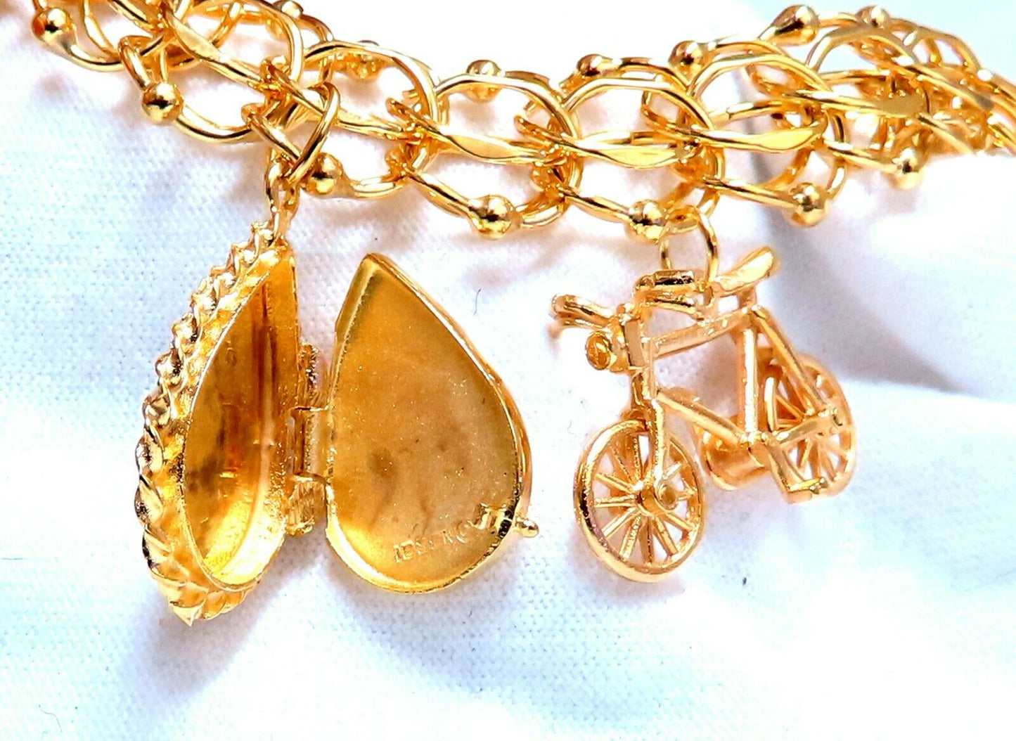 Nine Charms Link Bracelet 14kt gold 7 inch 54gm