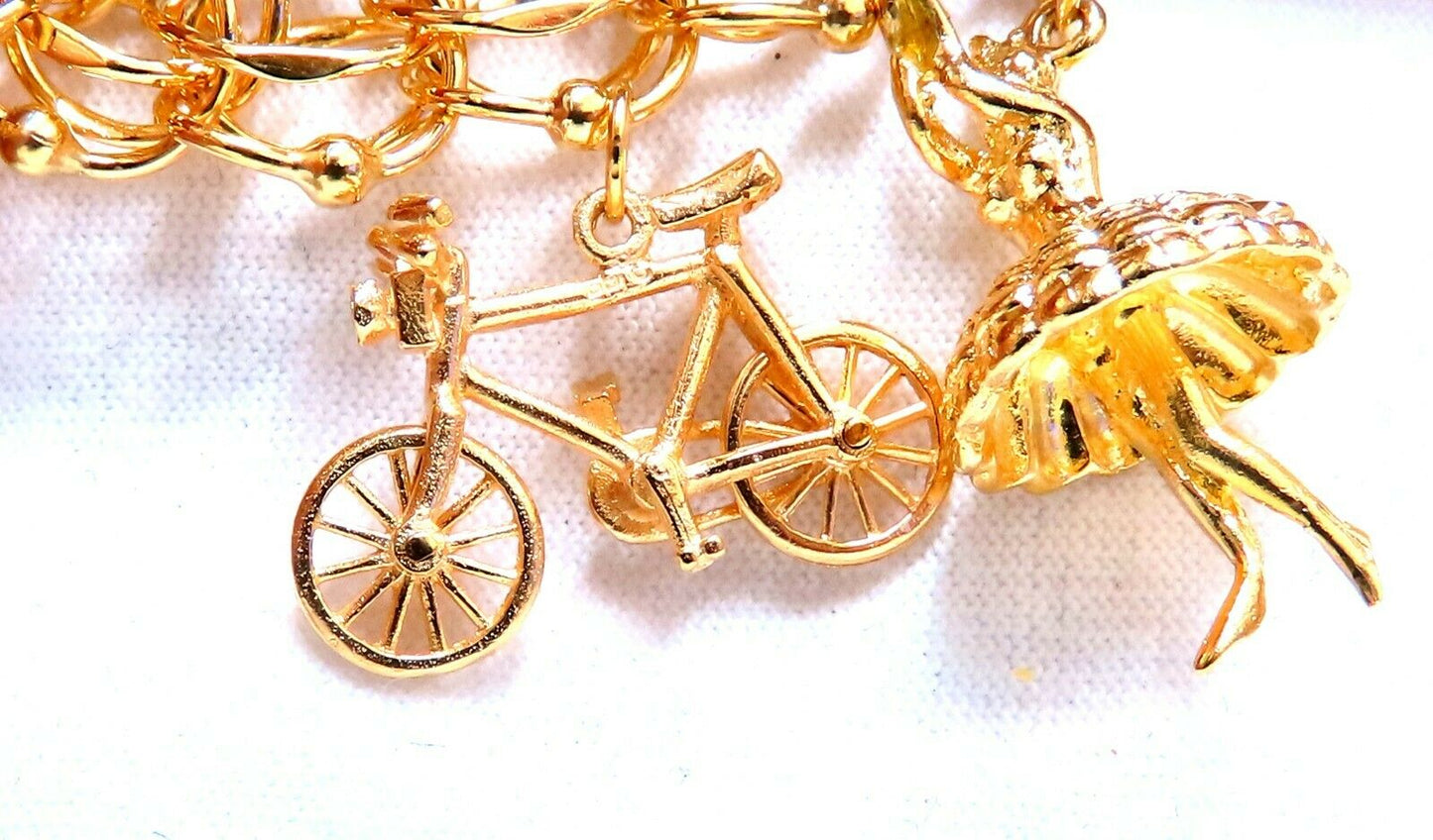 Nine Charms Link Bracelet 14kt gold 7 inch 54gm