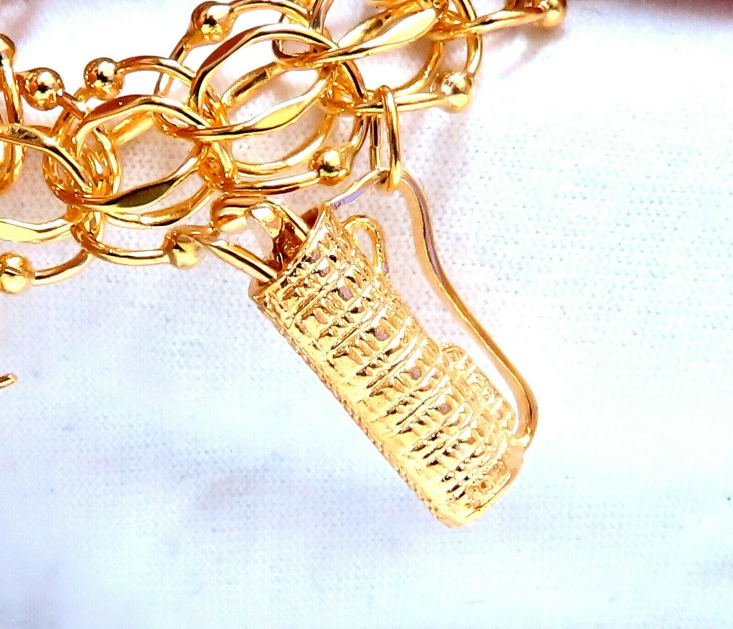 Nine Charms Link Bracelet 14kt gold 7 inch 54gm
