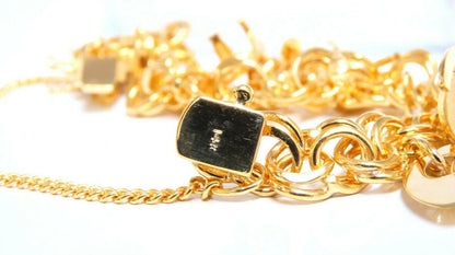 Eight Charms Link Bracelet 14kt gold 7 inch 43gm *v