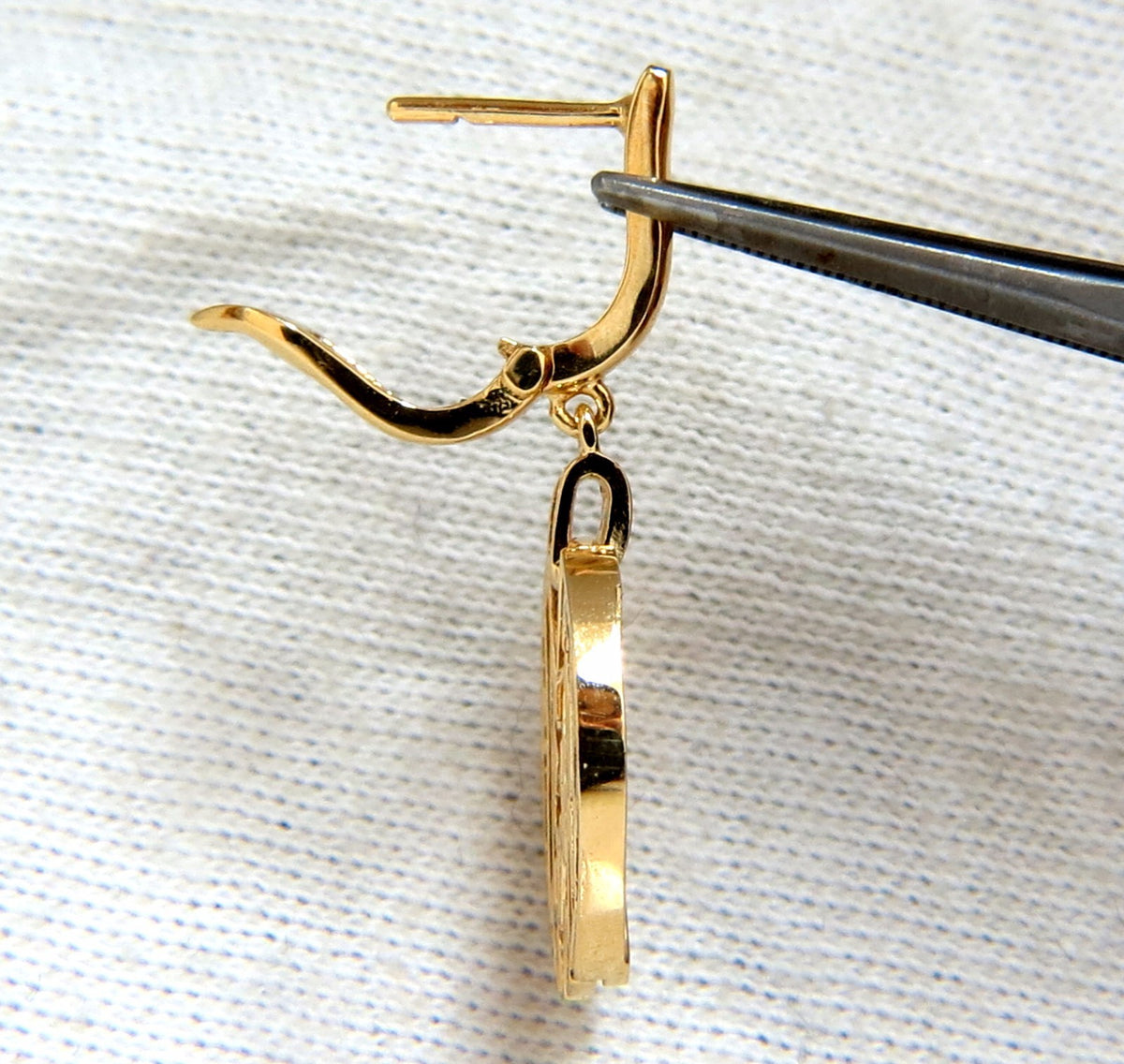 Cosmopolitan Mod X Diamond dangle earrings 14kt *v