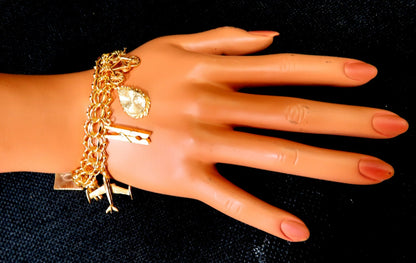 Nine Charms Link Bracelet 14kt gold 7 inch 54gm *v