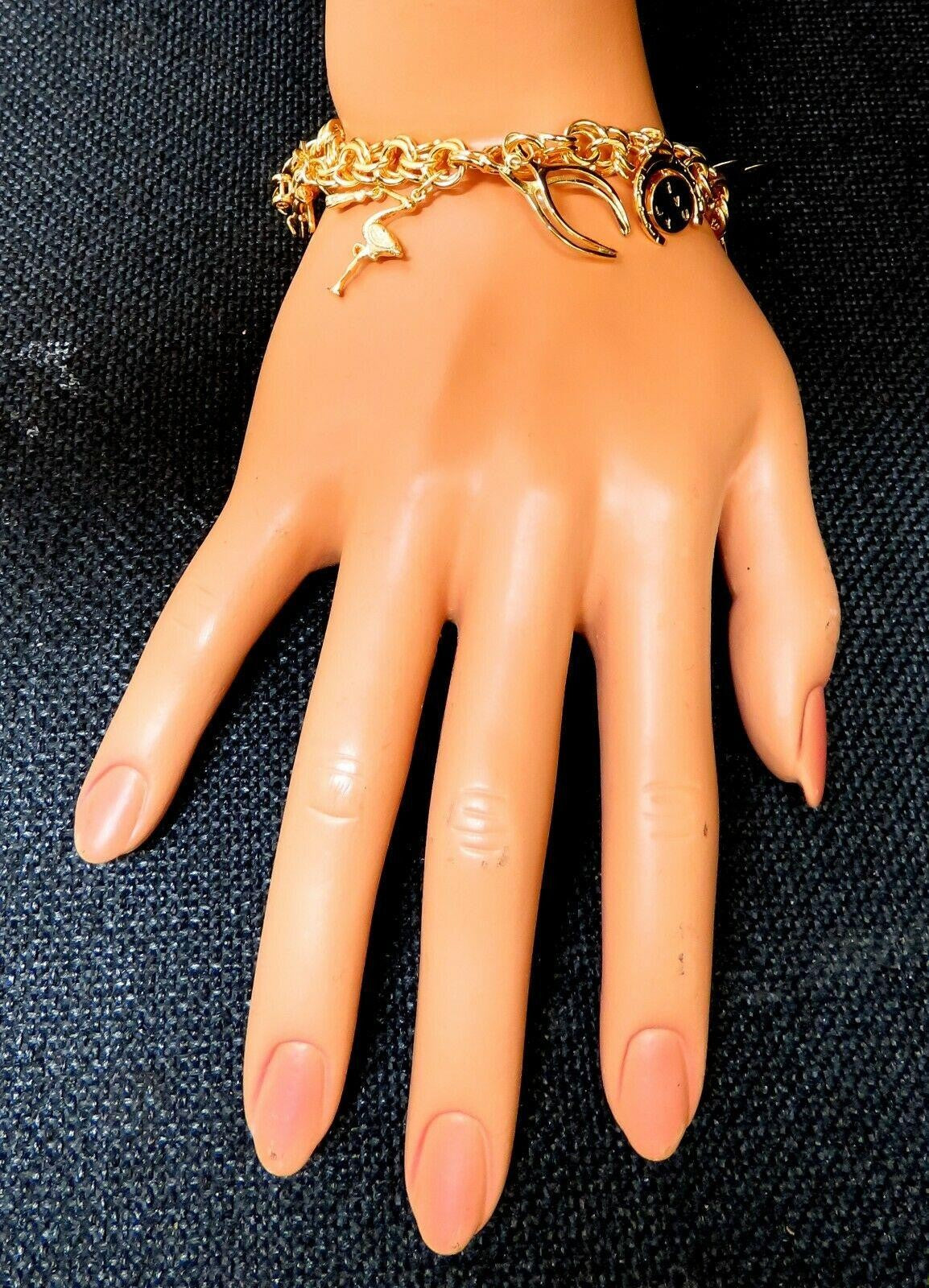 Eight Charms Link Bracelet 14kt gold 7 inch 43gm *v
