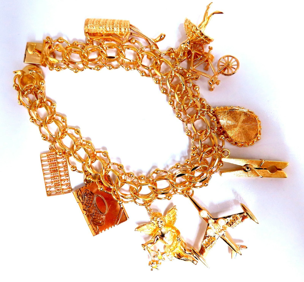 Nine Charms Link Bracelet 14kt gold 7 inch 54gm *v