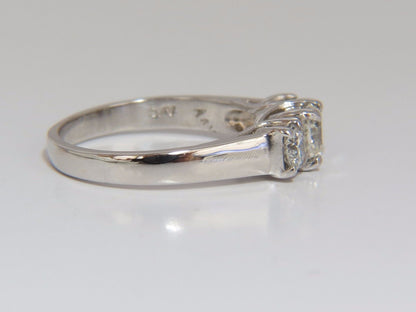 1.08CT CLASSIC THREE NATURAL CUSHION & ROUNDS DIAMOND RING 14KT