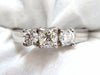 1.08CT CLASSIC THREE NATURAL CUSHION & ROUNDS DIAMOND RING 14KT
