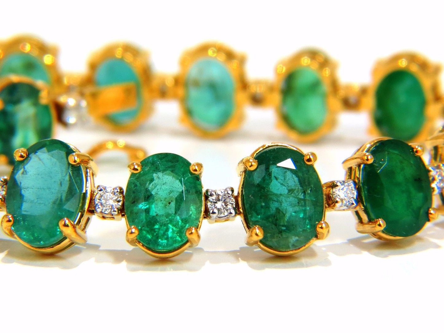 Emerald bracelet 27.42ct & .75ct diamonds classic tennis 14kt. natural greens
