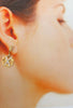 Cosmopolitan Mod X Diamond dangle earrings 14kt