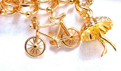 Nine Charms Link Bracelet 14kt gold 7 inch 54gm